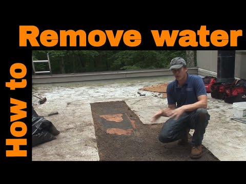 How to remove water from a flat roof